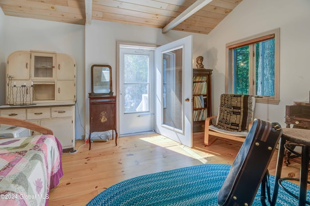 bedroom featuring multiple windows, light hardwood / wood-style floors, lofted ceiling with beams, and wooden ceiling