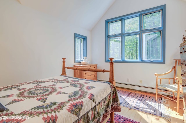 bedroom featuring lofted ceiling and hardwood / wood-style flooring