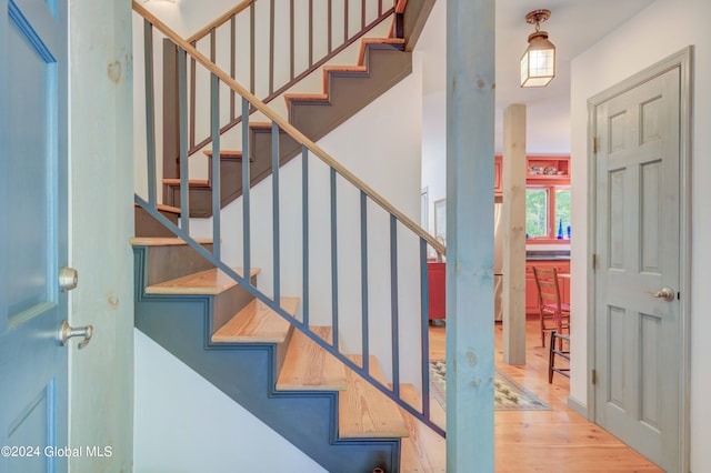 stairway featuring hardwood / wood-style floors