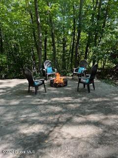 view of property's community with an outdoor fire pit