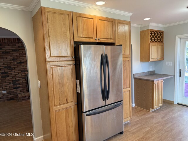 25 Kling Ter, Voorheesville, NY 12186 - kitchen with freestanding refrigerator, light wood finished floors, crown molding, arched walkways, and recessed lighting