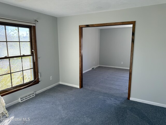 25 Kling Ter, Voorheesville, NY 12186 - empty room featuring dark colored carpet and baseboards