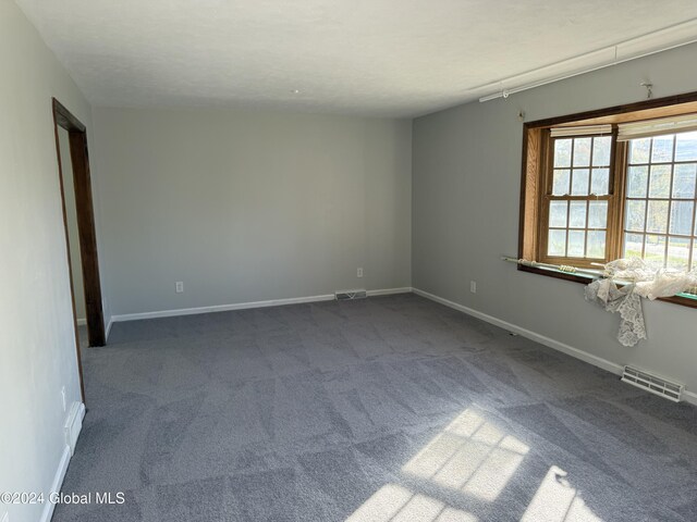 25 Kling Ter, Voorheesville, NY 12186 - spare room with dark colored carpet and baseboards