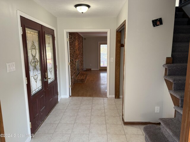 25 Kling Ter, Voorheesville, NY 12186 - entrance foyer featuring stairway, baseboards, light tile patterned floors, and french doors