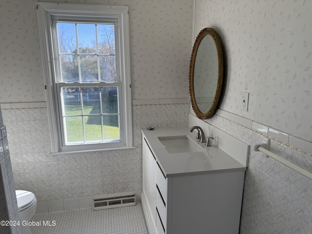 25 Kling Ter, Voorheesville, NY 12186 - half bath with plenty of natural light, a wainscoted wall, tile walls, vanity, and wallpapered walls
