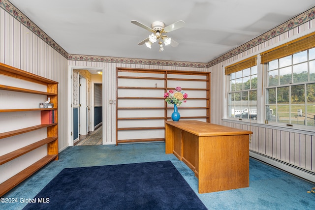 unfurnished office featuring baseboard heating, ceiling fan, and dark carpet