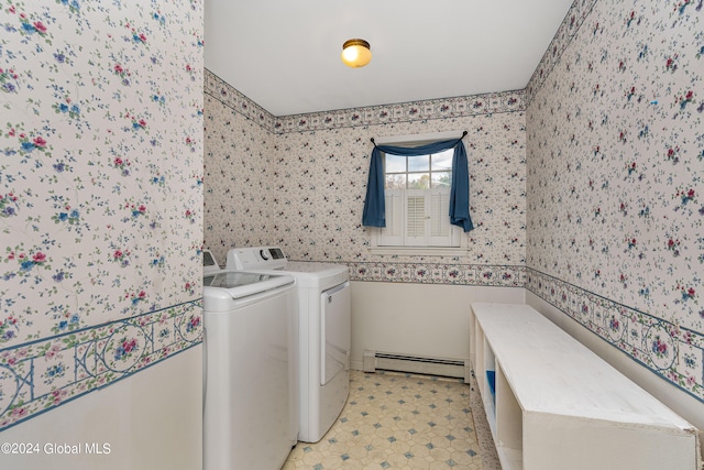 laundry room with washing machine and clothes dryer and a baseboard radiator