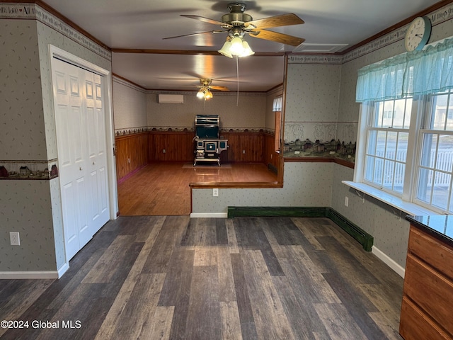 kitchen with ceiling fan, dark hardwood / wood-style flooring, and ornamental molding