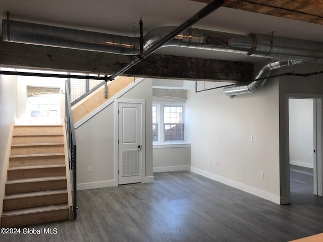 basement featuring dark hardwood / wood-style floors