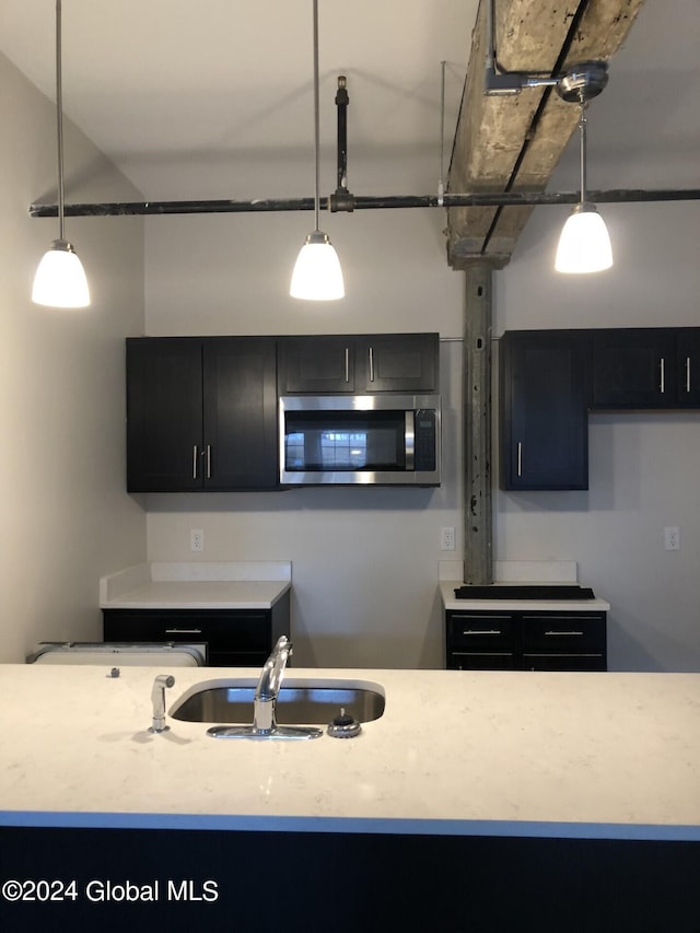 kitchen with sink and decorative light fixtures