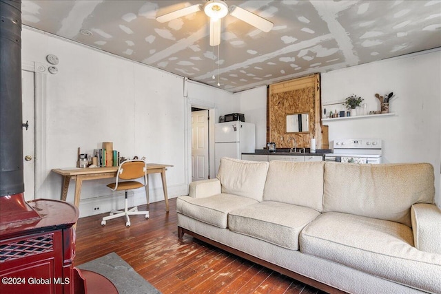 living room featuring ceiling fan, dark wood-type flooring, and sink