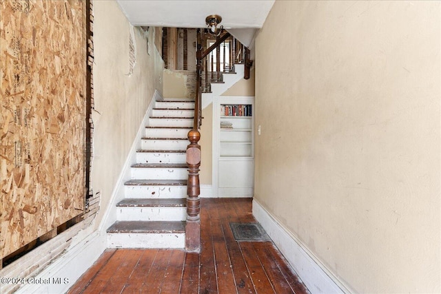 stairway featuring hardwood / wood-style flooring