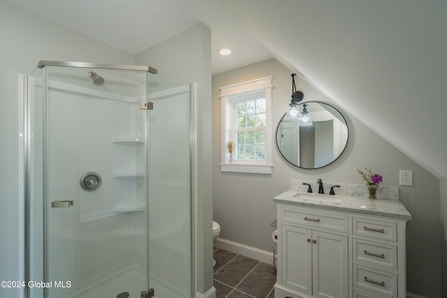 bathroom featuring lofted ceiling, vanity, toilet, and a shower with door