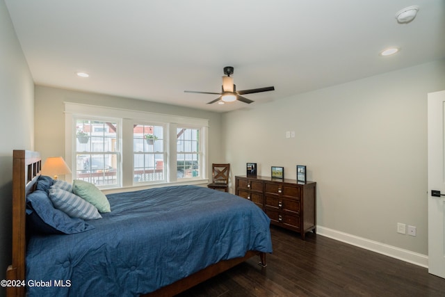 bedroom with dark wood-type flooring and ceiling fan