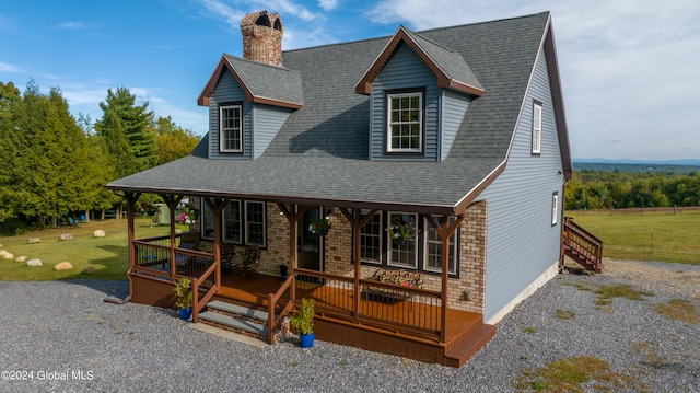 view of front of house with a porch and a front yard