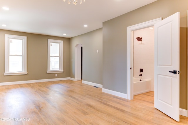 empty room with light hardwood / wood-style floors