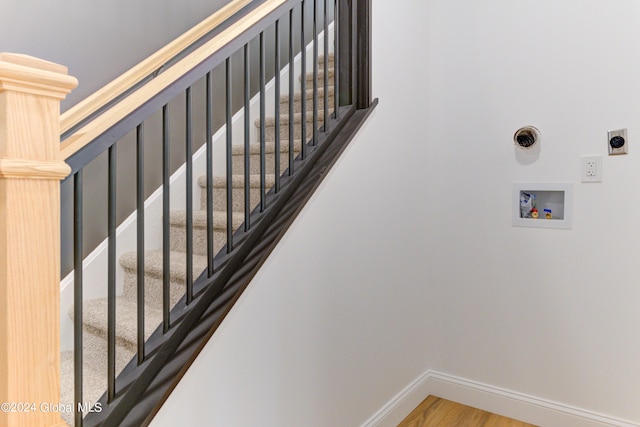 stairway featuring hardwood / wood-style flooring