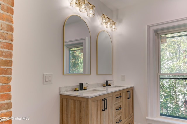 bathroom featuring a healthy amount of sunlight and vanity