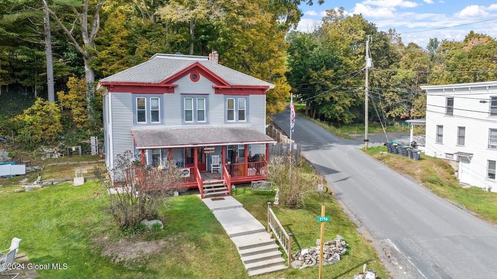 view of front of house featuring a front lawn and a porch