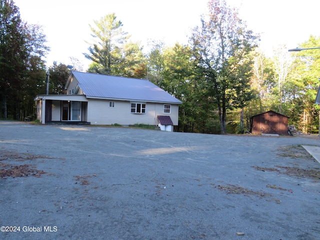 view of property exterior featuring an outdoor structure