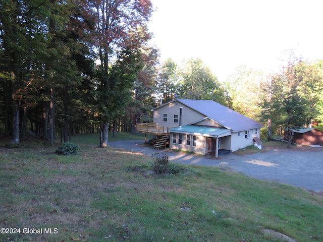 view of yard featuring a wooden deck