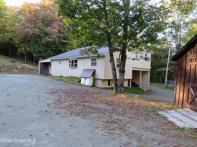 view of home's exterior featuring an outdoor structure