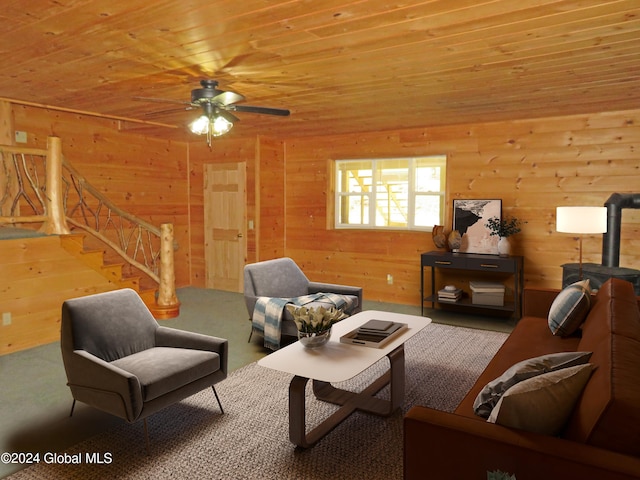 carpeted living room with wood ceiling, wooden walls, a wood stove, and ceiling fan