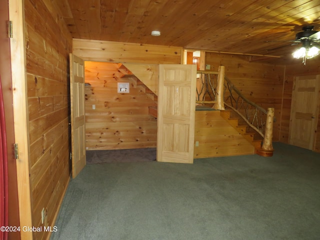 interior space featuring wood ceiling, wood walls, and carpet flooring