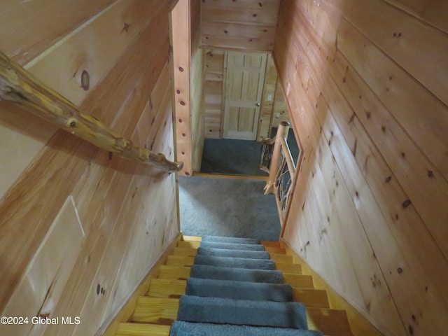 staircase with wooden walls