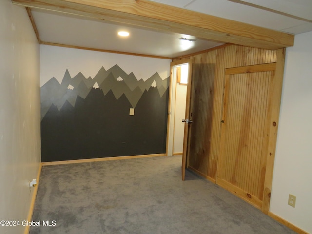 carpeted empty room with crown molding