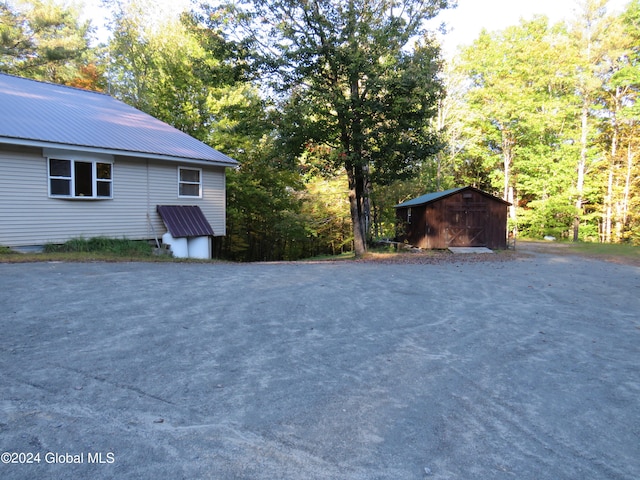 exterior space with a storage shed