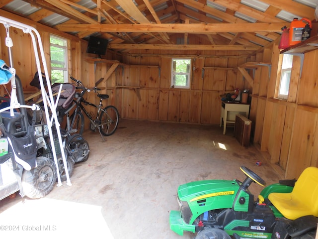 garage featuring wood walls