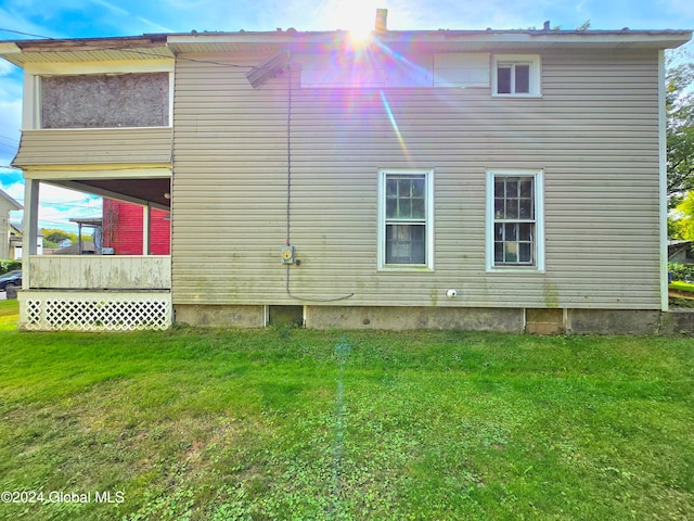 view of home's exterior featuring a lawn