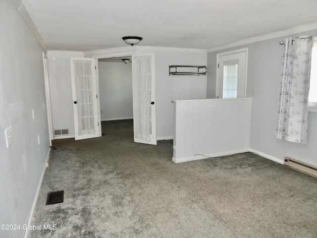 spare room featuring dark carpet and ornamental molding