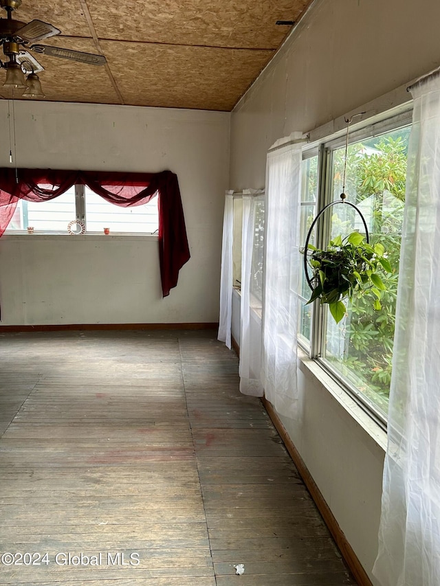 interior space with ceiling fan