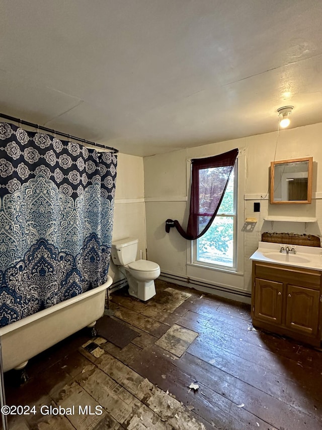 bathroom with baseboard heating, hardwood / wood-style flooring, vanity, and toilet