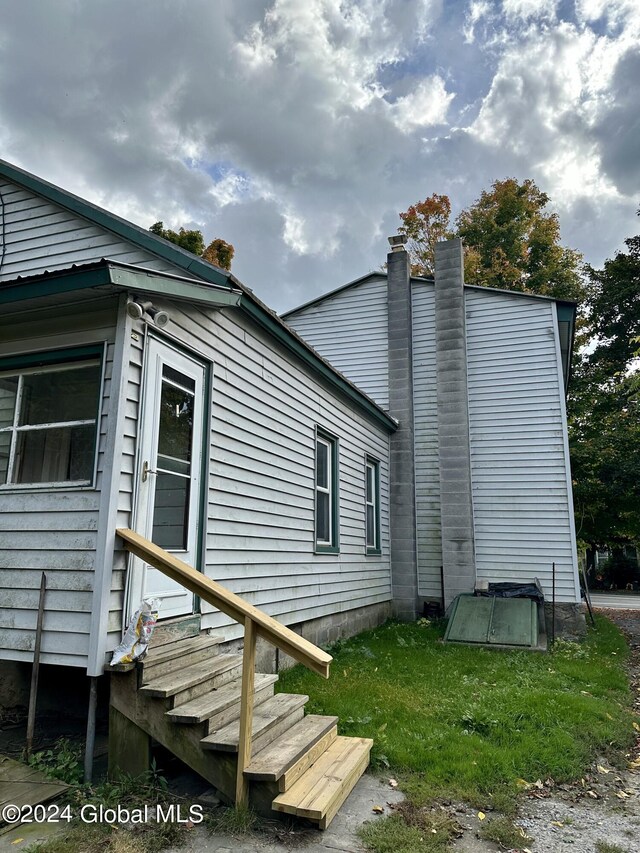 view of home's exterior featuring a yard