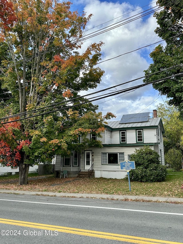 view of front of house featuring solar panels