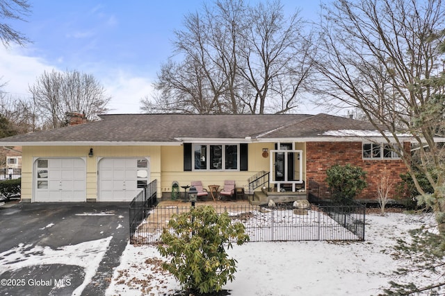 single story home with a garage