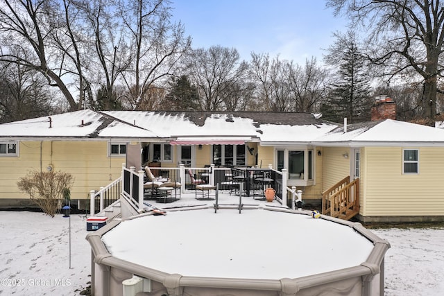 view of snow covered house