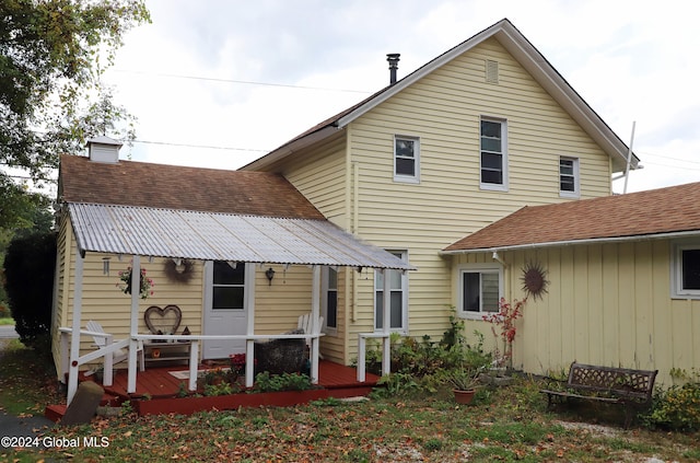 back of property with a deck