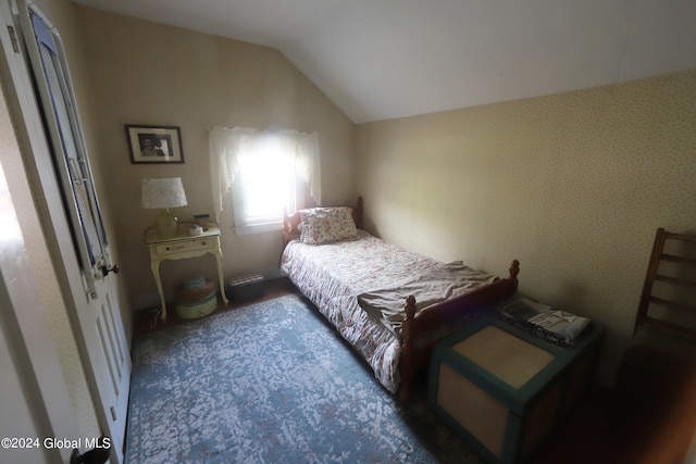 bedroom featuring lofted ceiling