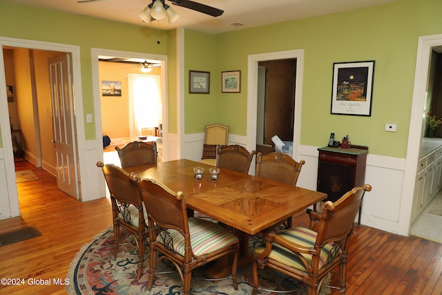 dining area featuring ceiling fan and hardwood / wood-style flooring