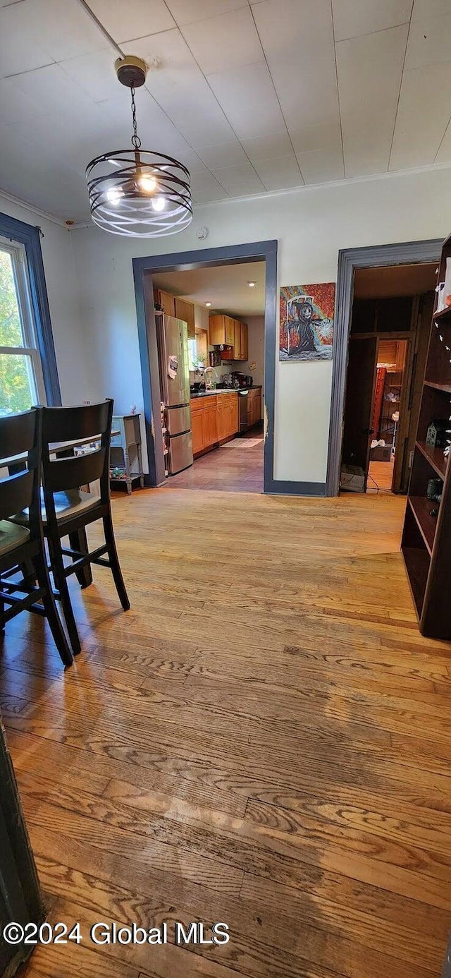 dining area featuring light wood-type flooring