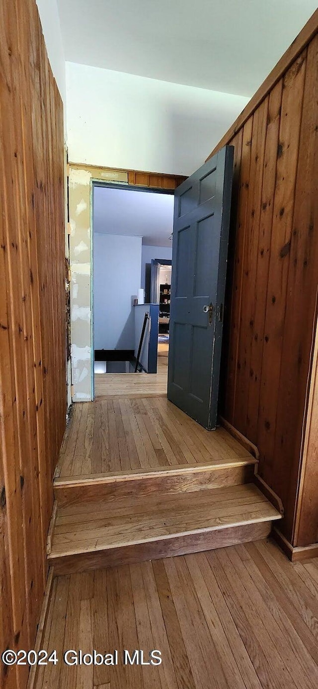 stairway featuring hardwood / wood-style floors