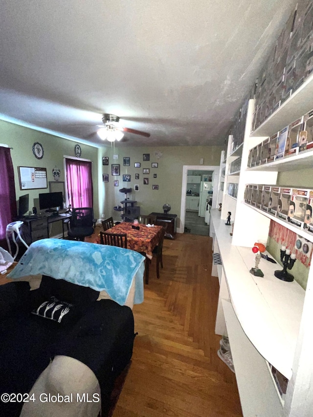 interior space with ceiling fan and a textured ceiling