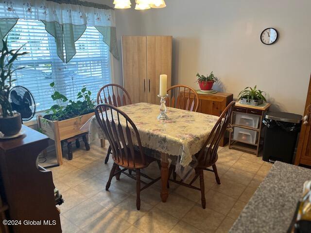 dining space featuring a notable chandelier