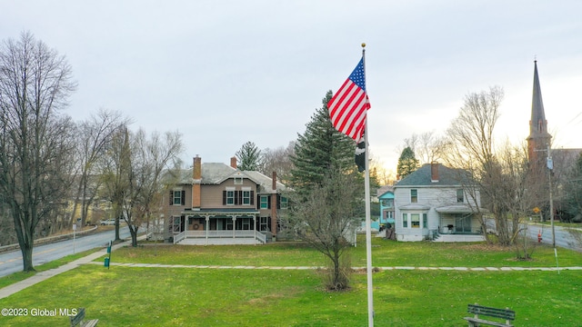 victorian home featuring a front yard