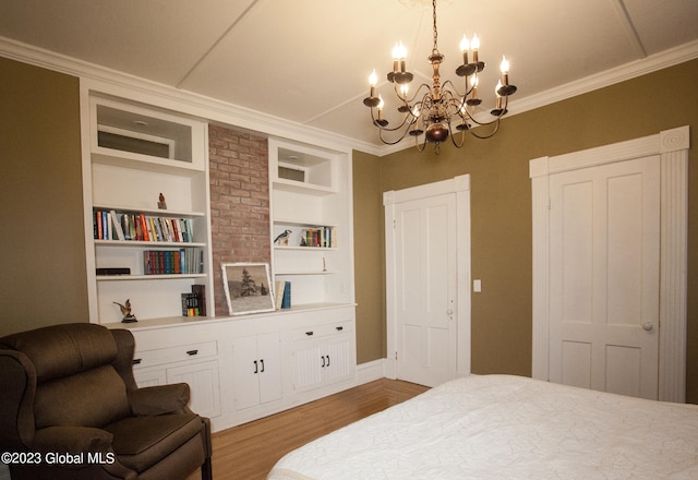 bedroom featuring light wood-type flooring, ornamental molding, and a chandelier