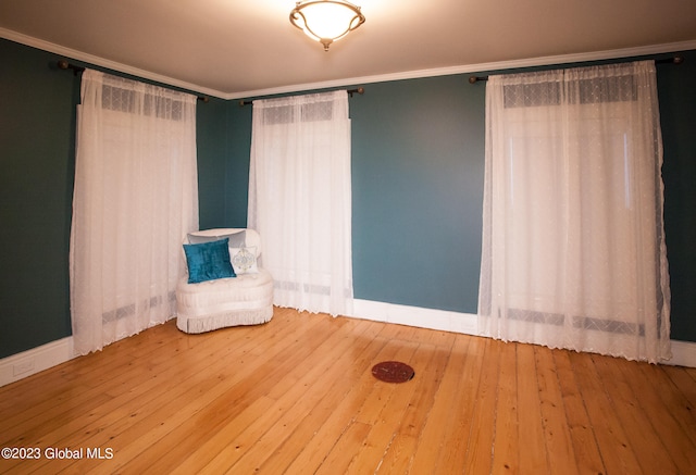 unfurnished room with hardwood / wood-style floors